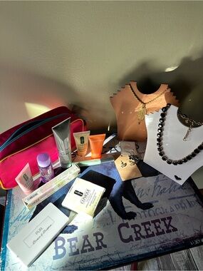 Clinique Cosmetic Bag with Assorted Clinique Skincare, Jewelry and more.